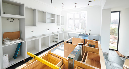 Kitchen in the middle of a renovation Counters and doors are off and drawers and cabnets are exposed