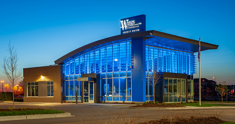 Exterior view of Maple Grove branch lit up at night