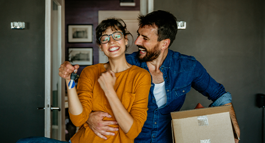 happy couple moving into their new home_520x280