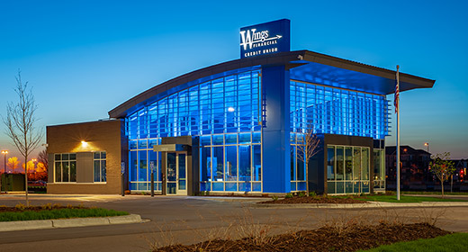 Exterior view of Maple Grove branch lit up at night
