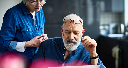 older couple looking at computer 520x280