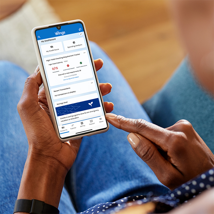 person using high yield checking tracker on phone