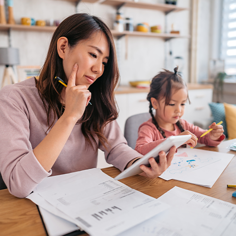 mother and daughter looking over finances week 1