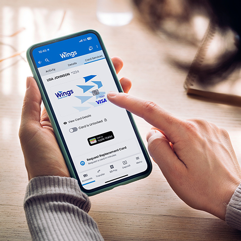 Person adding card to mobile wallet