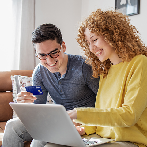 couple going through their finances while holding a wings card_480x480