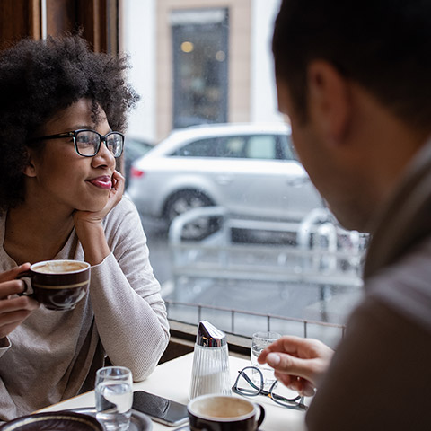 /getmedia/70eb91ae b5a2 45a6 ba4a 5f066931e58f/man and woman sitting at a cafe and enjoying coffee together