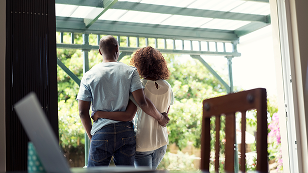 couple embracing on their back patio