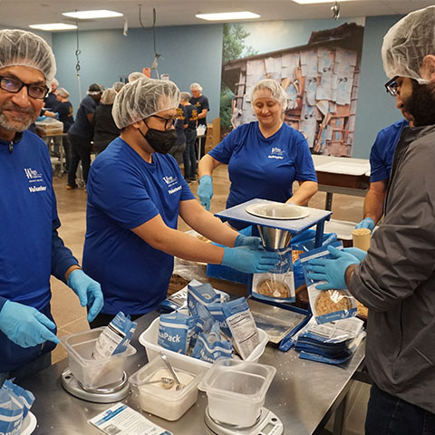 wings volunteers packing food donations