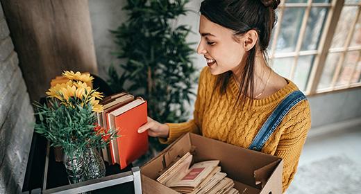 Woman unpacking to move into a new place_related