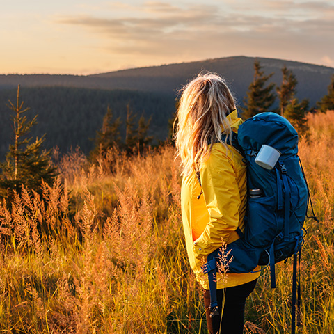 /getmedia/fb1a697b db5b 4746 8e12 0495791846f9/woman watching a sunset while hiking_480x480