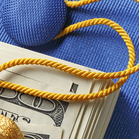 graduation cap and money