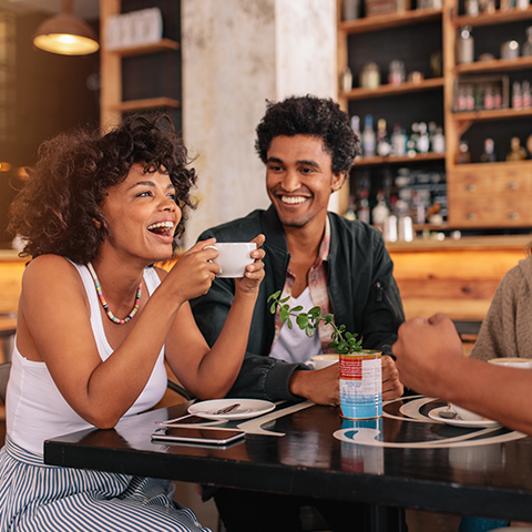 friends sitting at a table having coffee